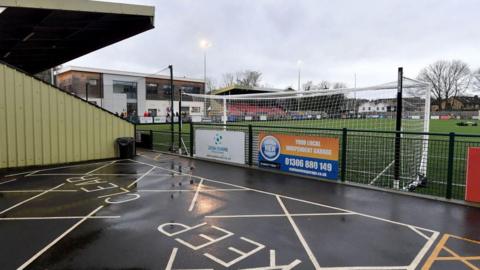 The Meadowbank Football Ground, Mill Lane, Dorking. On the left hand side, part of the stand can be seen close to the goalpost.