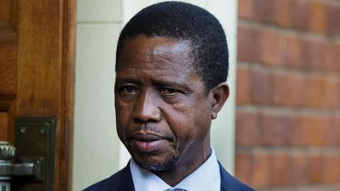 A close-up of Edgar Lungu wearing a suit 