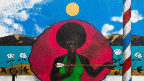 Madame La Sirene by Abe Odedina it depicts a black woman in a green dress holding an arrow and sitting in an large clam shell with a striped barbers pole beside her. In the foreground is a white and black dog in an orange and black basket on a red rug.