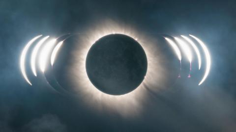 A picture of a solar eclipse. There is a large black sky with light in the middle from the moon.