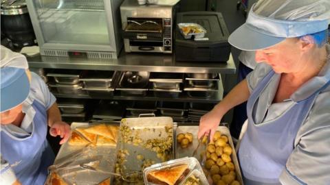 catering staff preparing meals