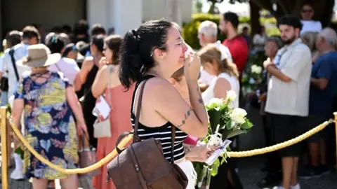 Mourners pay their respect at the wake of Diogo Jota being held at Sao Cosme Chapel in the town of Gondomar near Porto