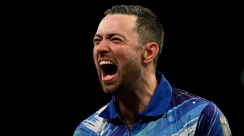 Luke Humphries celebrates victory during night 15 of the 2026 Premier League Darts at the Utilita Arena, Birmingham