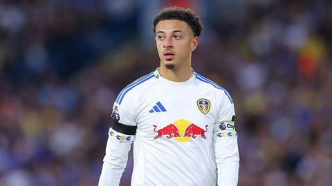 Ethan Ampadu wearing the white colours of Leeds United and a captain's armband.