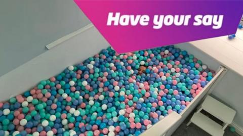 A ball pit with the words 'have your say' top right corner.