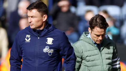 Scott Parker looks down next to Paul Heckingbottom