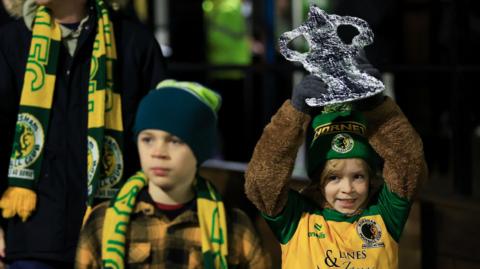 Horsham fans with a tin foil FA Cup