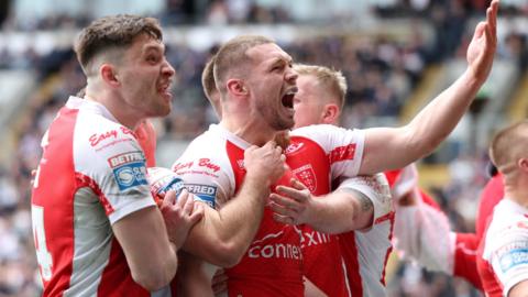 Hull KR celebrate James Batchelor's try, with Sam Wood embracing the back-rower