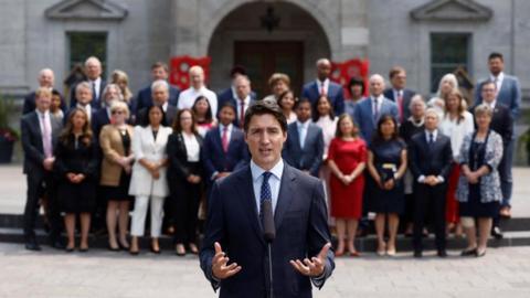 Canada's Prime Minister Justin Trudeau speaks to the media, as cabinet ministers stand behind him, following a cabinet shuffle, at Rideau Hall, in Ottawa, Ontario, Canada, July 26, 2023.