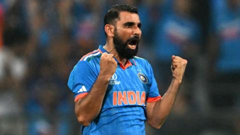 India bowler Mohammed Shami roars in celebration after taking a wicket