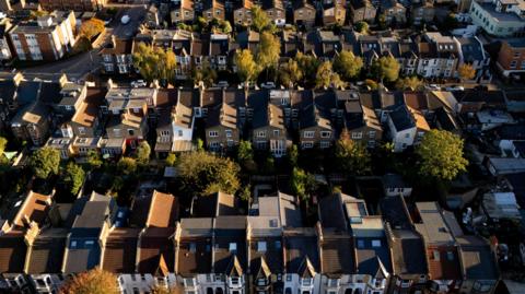 An aerial view of about 100 houses