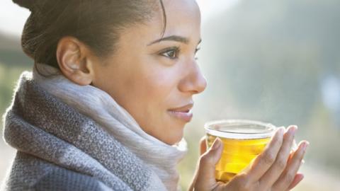 Woman with hot tea