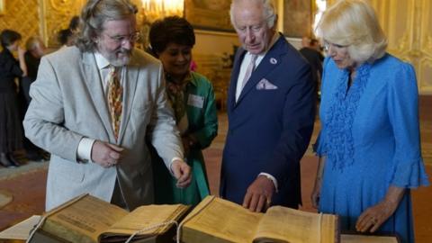 Queen Camilla looks at the second Shakespeare Folio