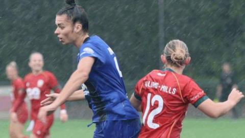 Gwalia United and Bournemouth players in action