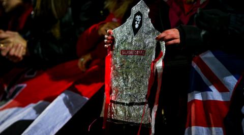 Salford City fan holds homemade FA Cup