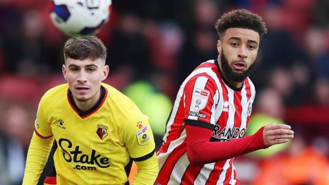 Sheffield United's Jayden Bogle (right) and Watford’s James Morris battle for the ball