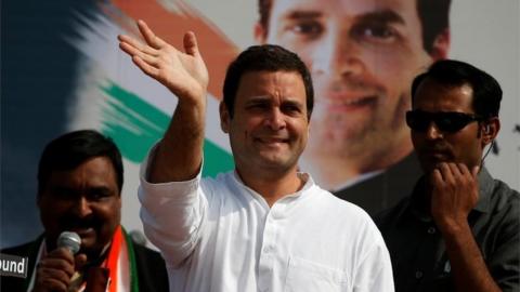 Rahul Gandhi of the main opposition Congress Party waves to his supporters during a rally ahead of Gujarat state assembly elections, at a village on the outskirts of Ahmedabad, India November 11, 2017