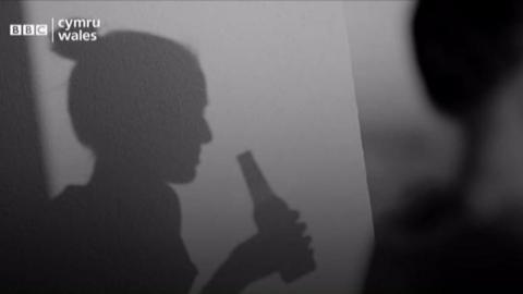 Silhouette of woman drinking alcohol