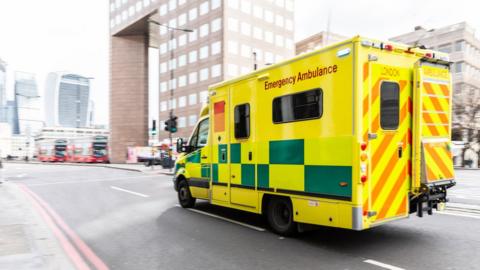 Ambulance travelling on a road