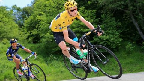 Chris Froome riding a Pinarello bike during a Tour de France stage