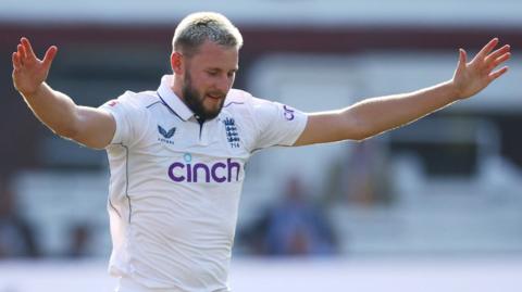 England bowler Gus Atkinson celebrates taking a wicket