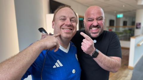 The pair posing after the shave in the BBC Radio Leicester reception
