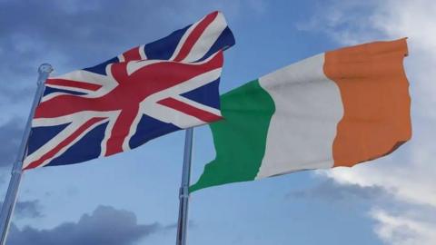 A UK flag and a Republic of Ireland flag