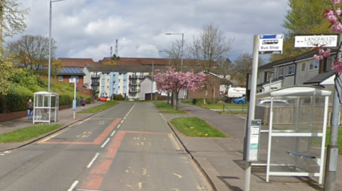 A google image on two bus stops on the opposite sides of Faifley Road with flats and houses on either side