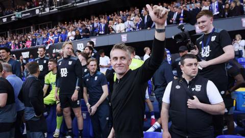 Kieran McKenna waves to crowd