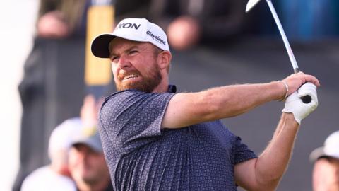 Shane Lowry hits an iron shot at the Open