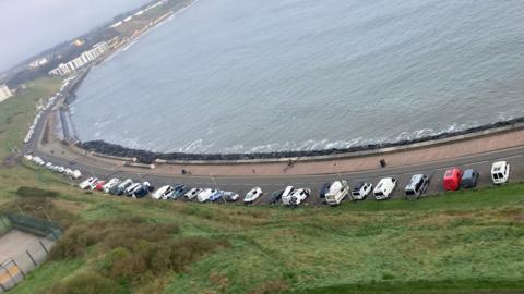 Motorhomes parked up along Royal Albert Drive in Scarborough's North Bay