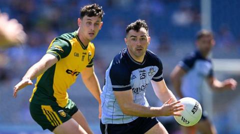 Colm Basquel is tracked by Michael Langan