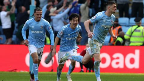 Coventry players celebrate the 97th-minute winner against Stoke City