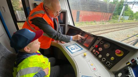 Alfie and Barry in the train cab 