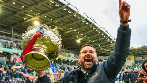 David Healy celebrates with trophy