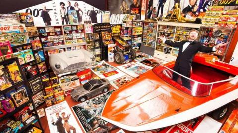 Nick Bennett with James Bond memorabilia collection