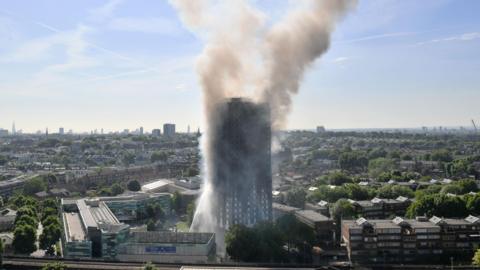 Smoke billows from a fire that has engulfed the 24-storey Grenfell Tower in west London in July, 2017.