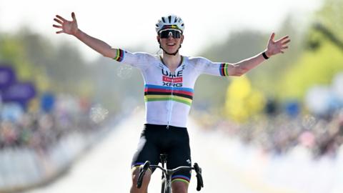 Tadej Pogacar holds his hands out wide as he celebrates winning the 2026 Tour of Flanders