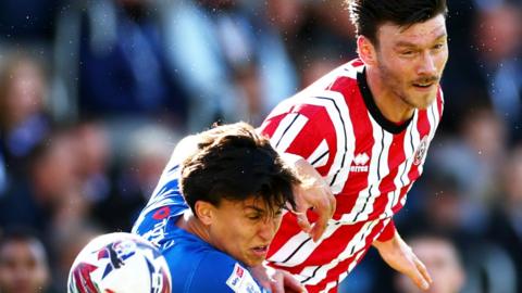 Kieffer Moore of Sheffield United tries to win the ball