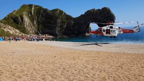 medical episode on the beach at Durdle Door