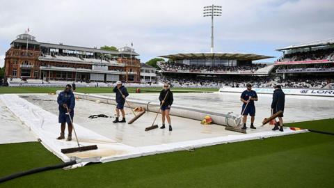 Lord's groundstaff at work during a rain delay