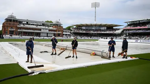 Lord's groundstaff at work during a rain delay