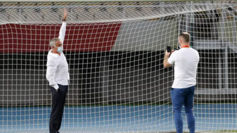 Jose Mourinho reaches up to touch the crossbar in Skopje