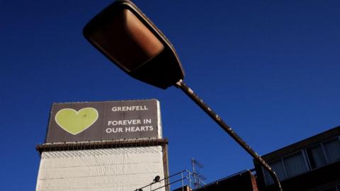 Grenfell Tower with a lamp post in the foreground