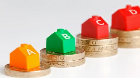 Council tax houses on coins