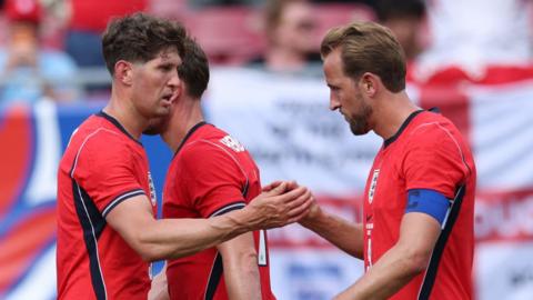 John Stones congratulates Harry Kane