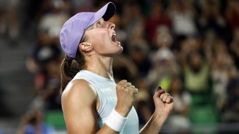Iga Swiatek yells in celebration after beating Ekaterina Alexandrova to win the Korea Open