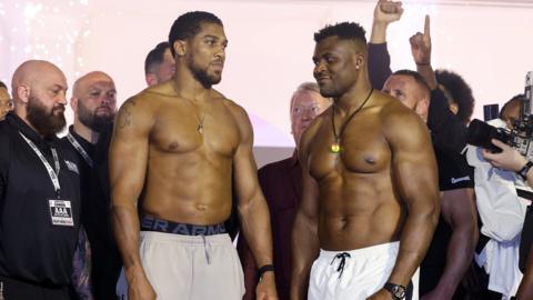 Anthony Joshua and Francis Ngannou pose at the weigh-in