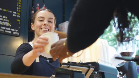 Woman serving coffee