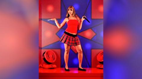 Pop star, Pinkpantharess dances on a stage